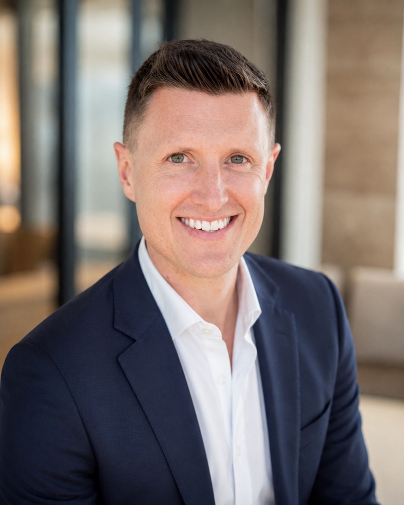 Kaleb Seymour, founder of 72 North Capital, in a navy jacket and white shirt